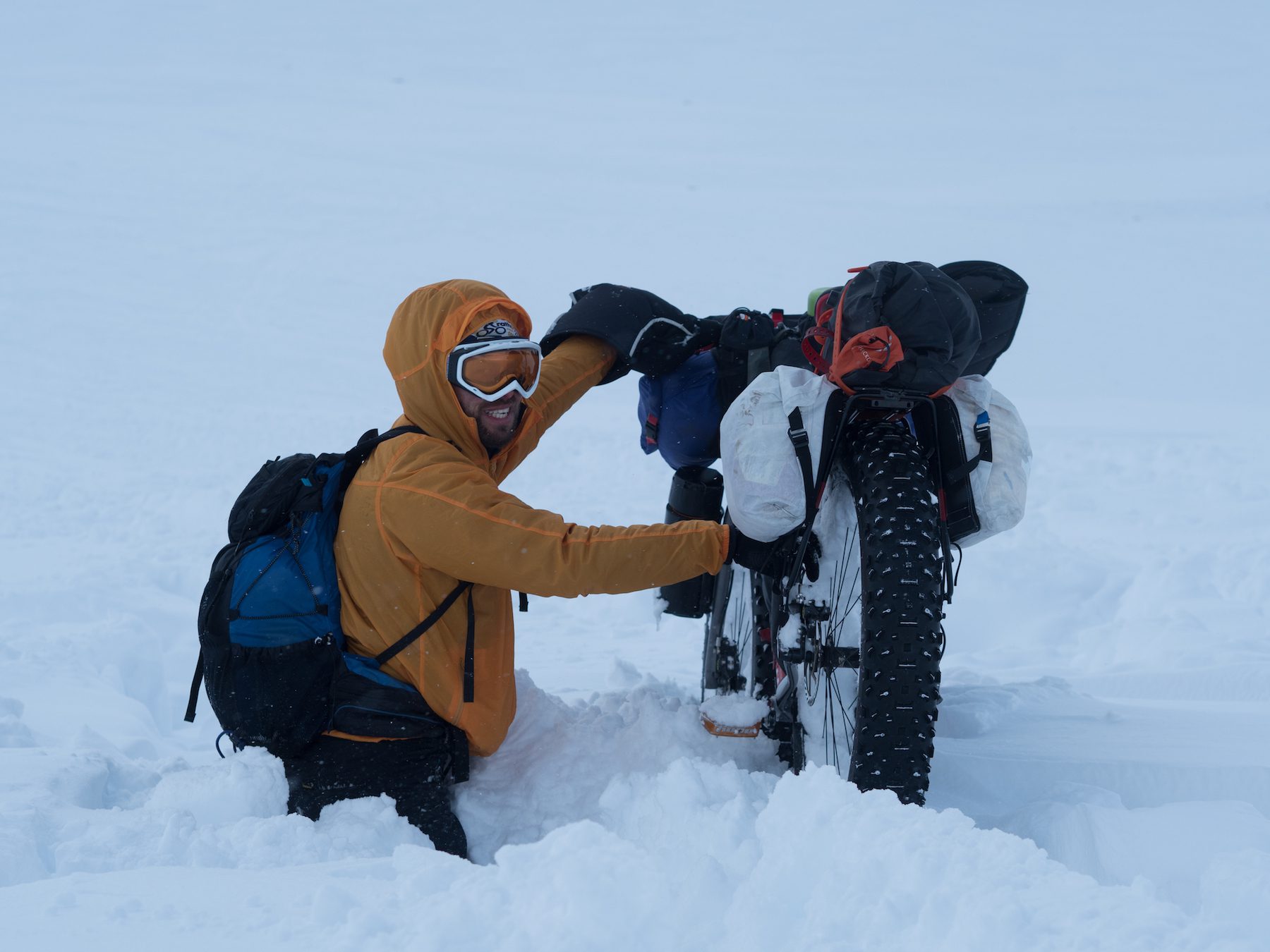 "The silencing blanket of fresh snowfall might cover the smaller features of a landscape, but that doesn’t mean that they aren’t there… A sense of humour was needed to get across the deep drifts of the mountain valleys, where the strong winds had dumped metres of snow into burn lines and gulleys. Falling up to your thighs for the twelfth time that afternoon kind of stooped being funny after a while, but the brief glimpses of the coires and summits surrounding us made up for it when a break in the cloud allowed them to reveal themselves momentarily. I think this might have been ‘pretend smile’ mode though…" ~Huw Oliver