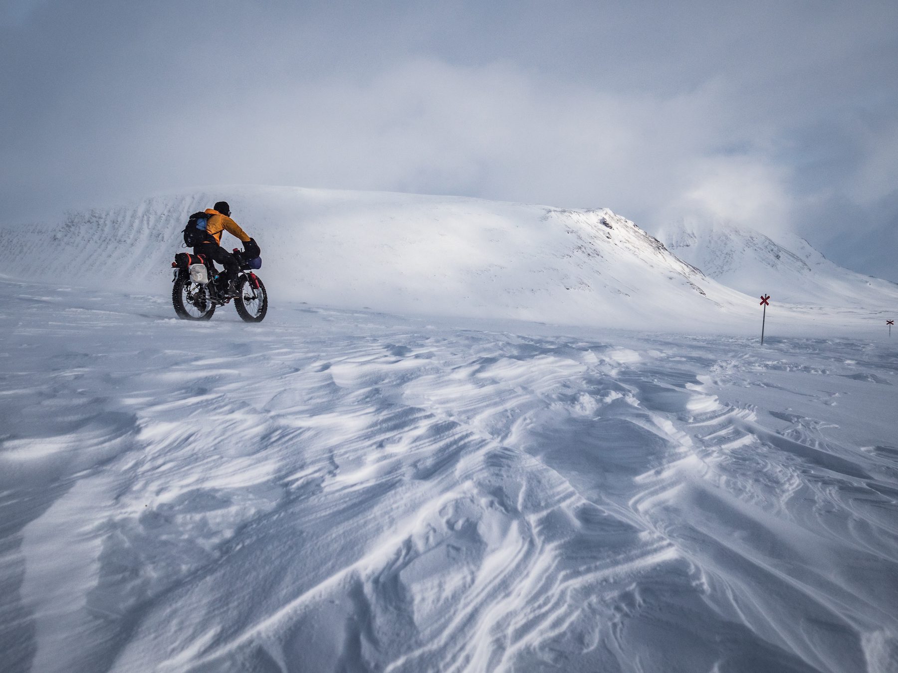 "Maybe because I’m not from a super snowy country, I still find a magic in snow covered landscapes. The snow is never the same, influenced and carved by wind before and after falling and temperature. As we rode with the gale force winds, it was almost like watching a mason at work, shaping the snow into new shapes before our eyes. These huge areas of sastrugi were stunning, often causing us to stop to simply admire them." ~Annie Le Evans