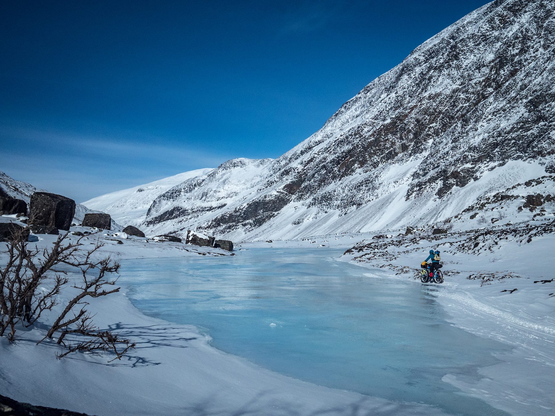 "We learned so much on this trip. Coming from a mild country, we had never experienced such cold temperatures and the landscape features associated with them. Pressure ridges and overflows (as shown in this photo) fascinated and scared me. Fortunately we were always able to sneak around the sides rather than have to cross these areas." ~Annie Le Evans